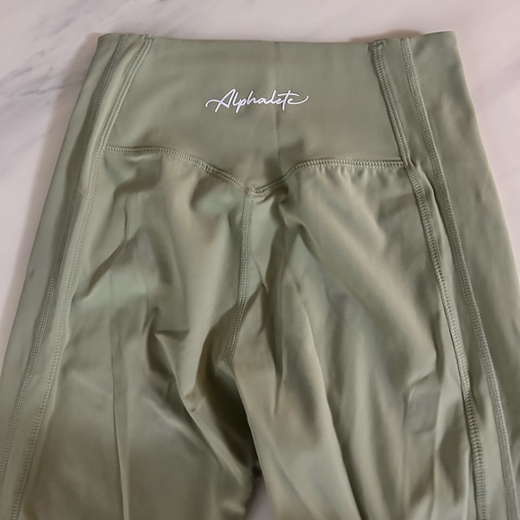 Almost brand new alphalete leggings. Size Md. Medium compression. Sage green. - Picture 4 of 5